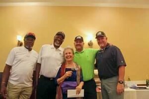 CAH Golf sponsors with Jan smiling and having a great time. 