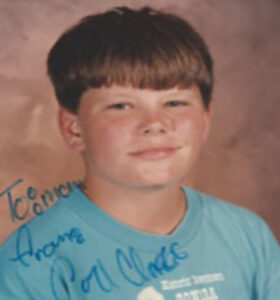 Carl wearing a light blue shirt. 